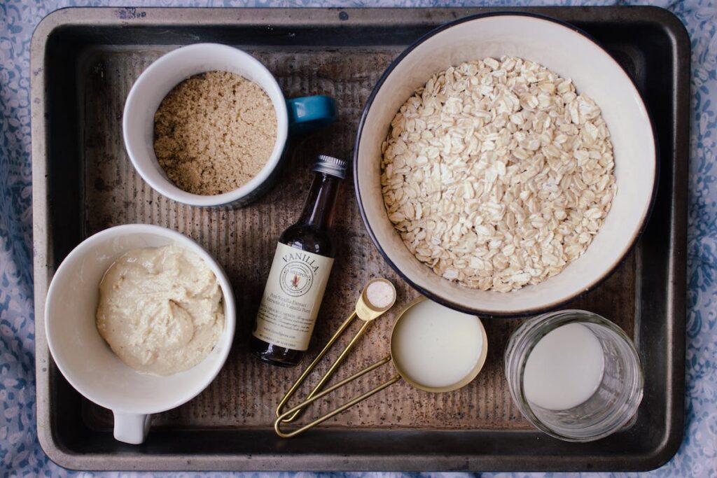 A picture taken from above, of 3 bowls with food in them such as grains.