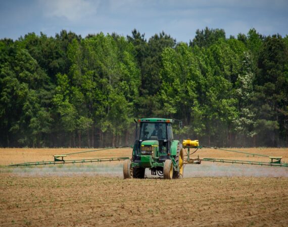 A tractor spraying something on a field