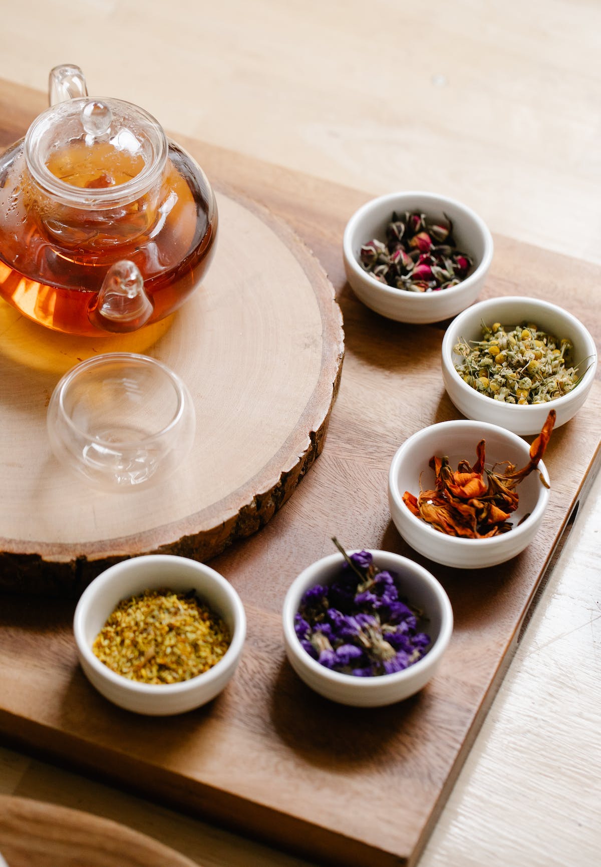 Different foods in small bowls, such as nuts and grains.